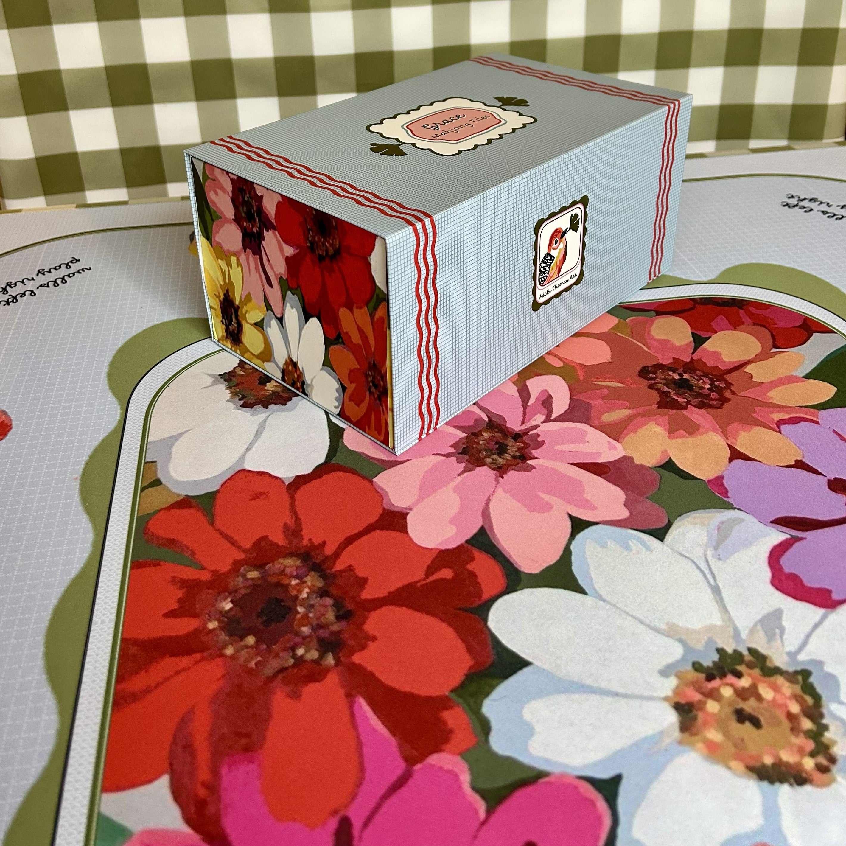 Floral-themed box with a checkered tablecloth background